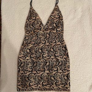 NWT Women’s XS Gold Lace dress over black fabric.